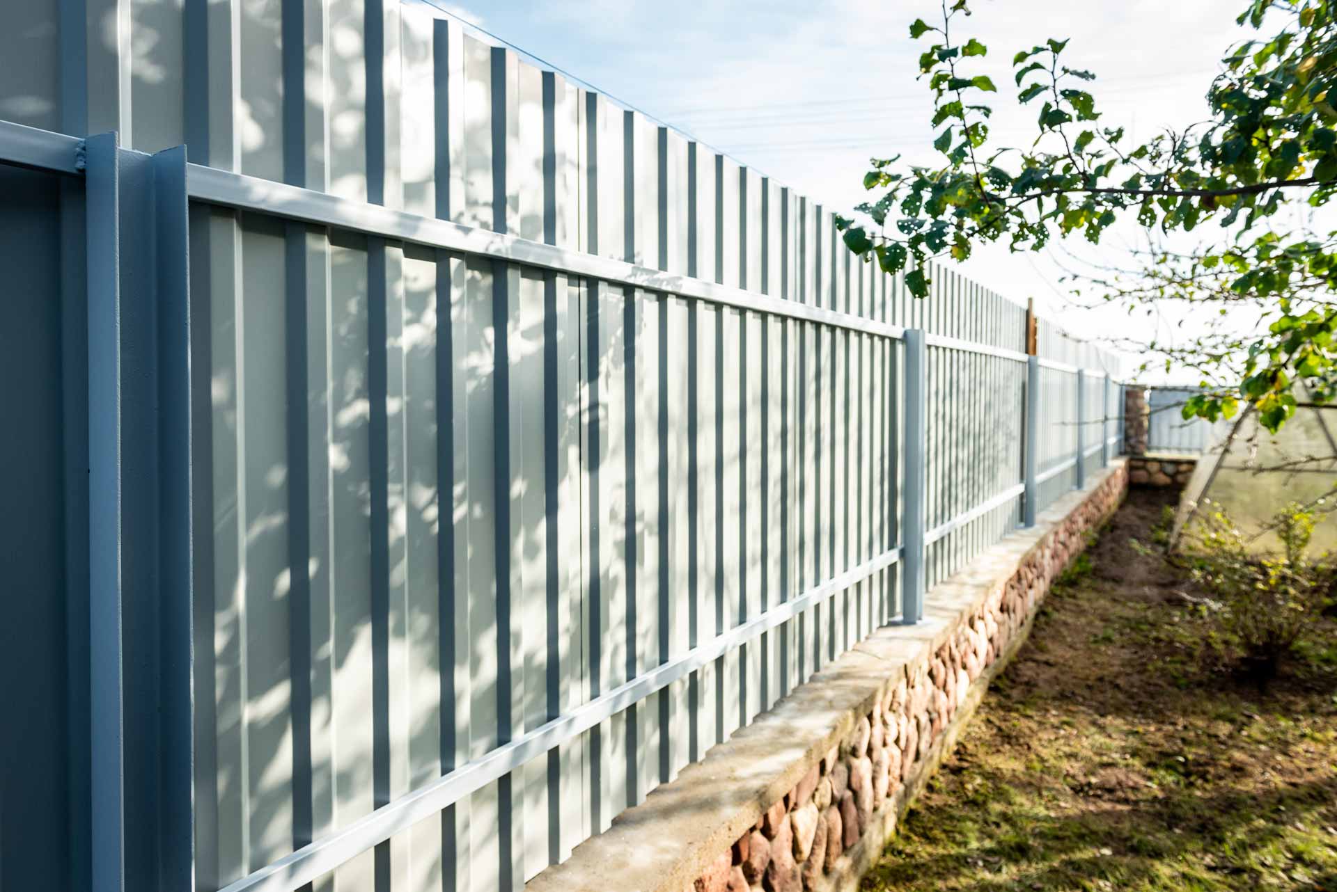 Corrugated steel fence