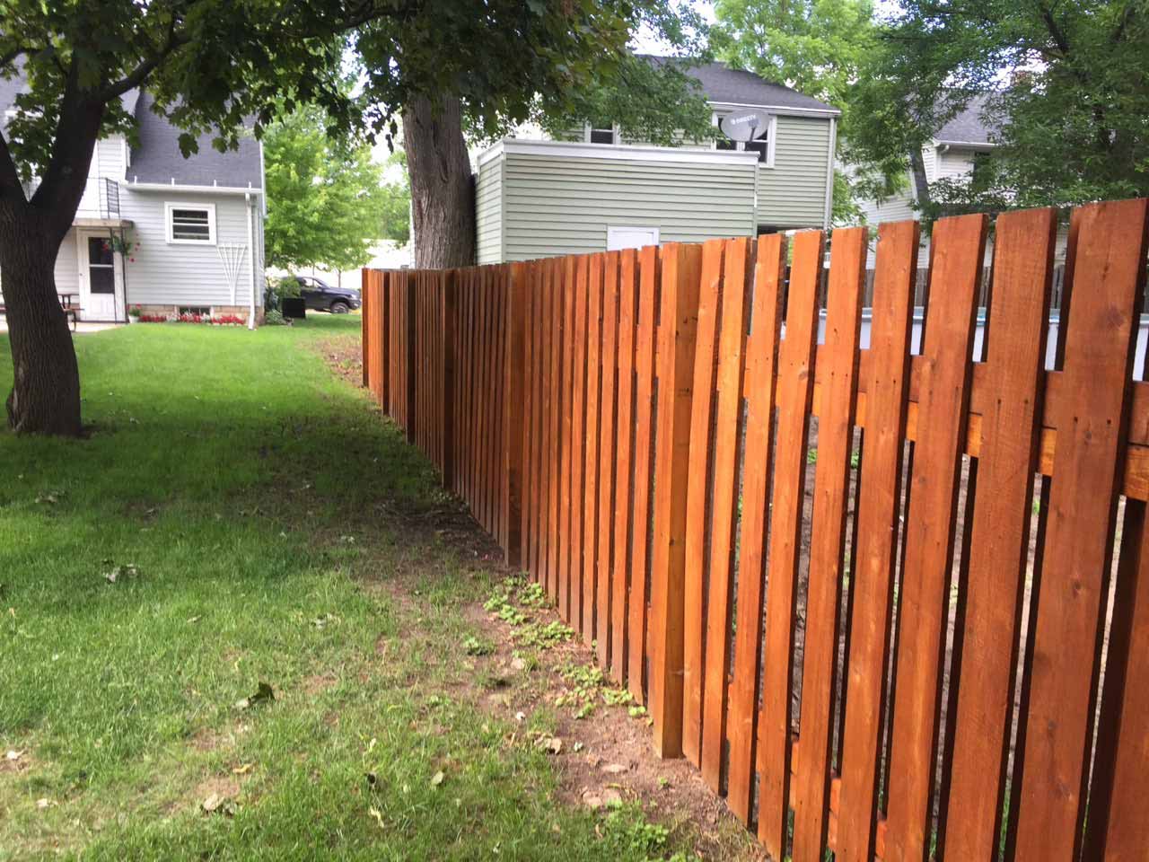 New wooden fence installed by Finest Fencing LLC